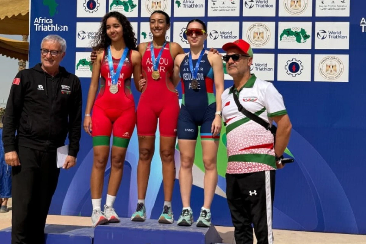 Millimiz Misirdən [[medalla qayıdır]]